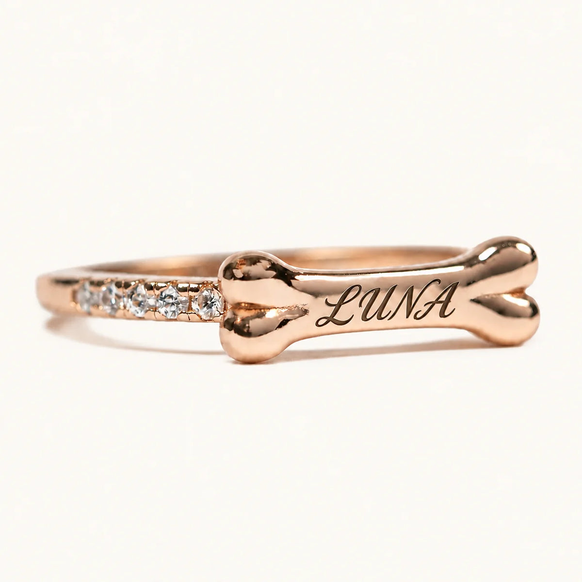 Rose gold personalized bone ring engraved with LUNA and zirconia accents
