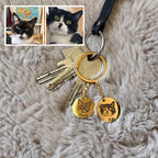 Photos of cats Snowy and Ruby in the same order as their keychain engravings